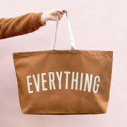 Oversized tan canvas tote bag with EVERYTHING slogan by Alphabet Bags.