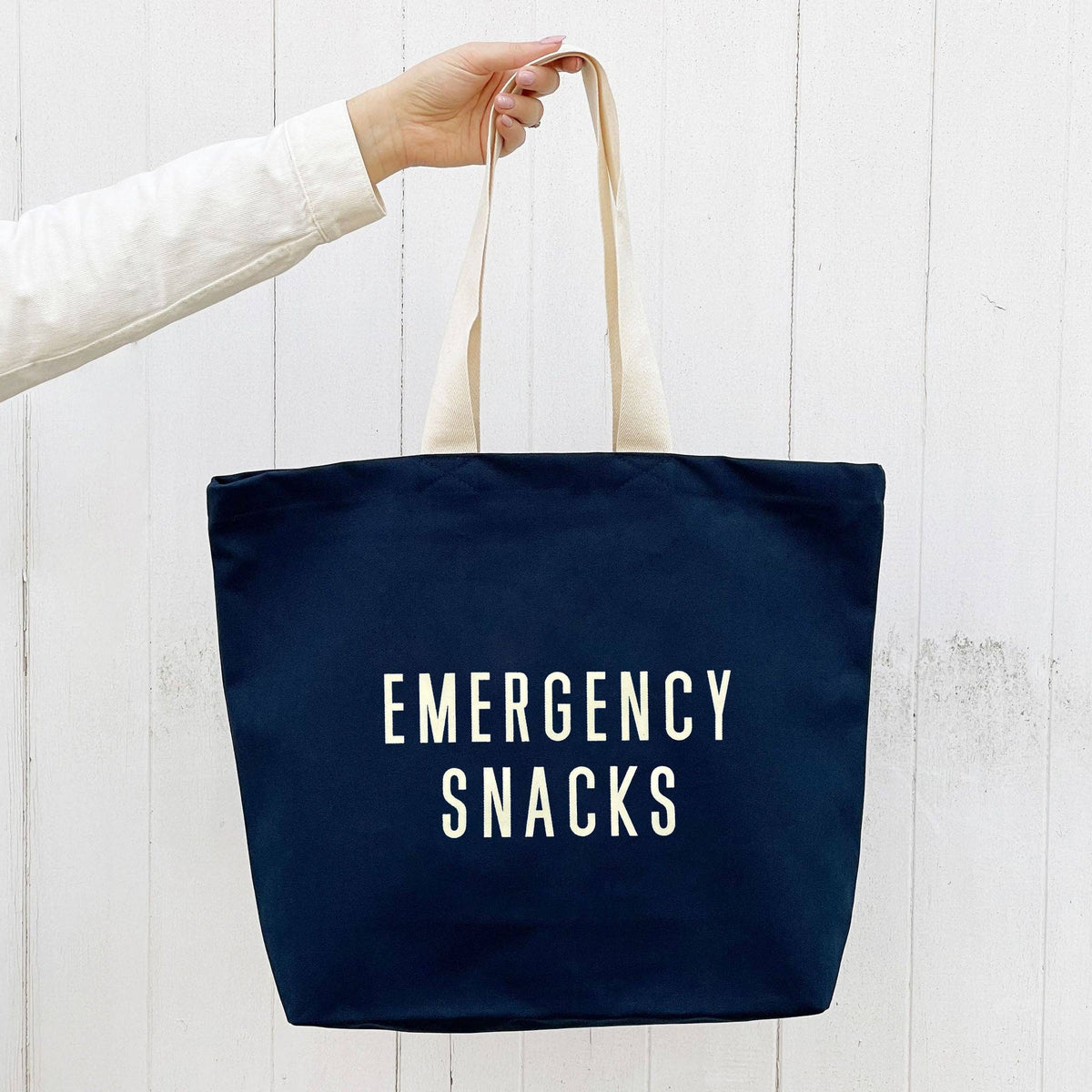 Alphabet Bags Emergency Snacks midnight blue canvas tote bag with off-white print.