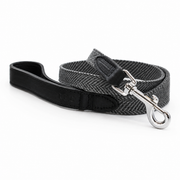 Close-up of Balmoral dog lead featuring grey herringbone fabric and black Italian leather