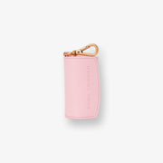 Barc London blush pink vegan leather dog waste bag holder with rose-gold hardware.