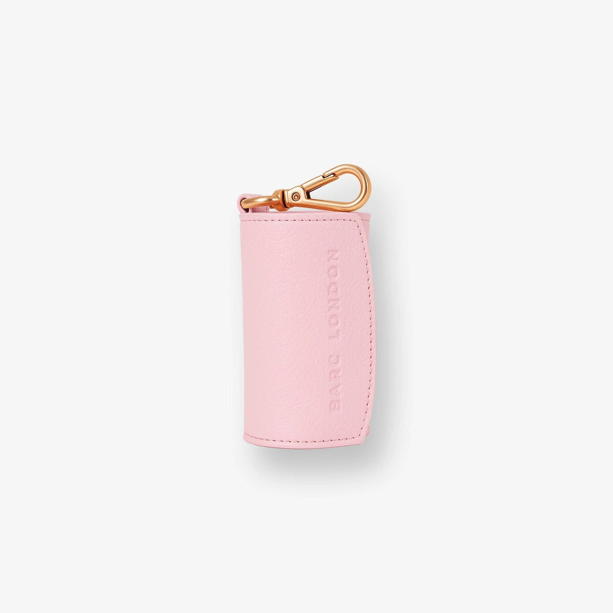 Barc London blush pink vegan leather dog waste bag holder with rose-gold hardware.