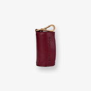 Barc London Merlot Red dog waste bag holder with gold-tone hardware.