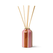 Black Cedar and Fig reed diffuser in a colourful hand-painted ceramic Tiger vessel.
