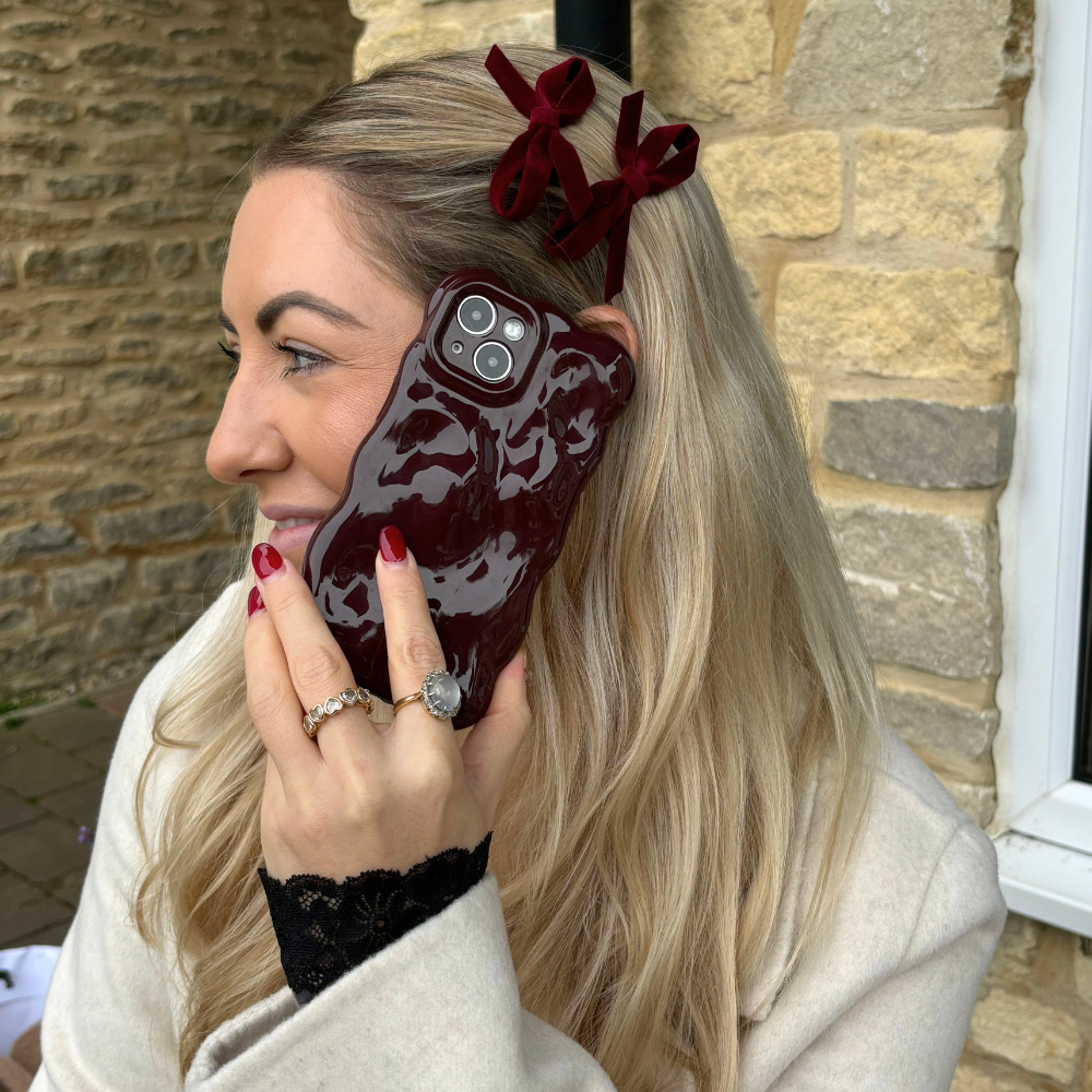 Set of two burgundy mini bow hair clips by Coconut Lane