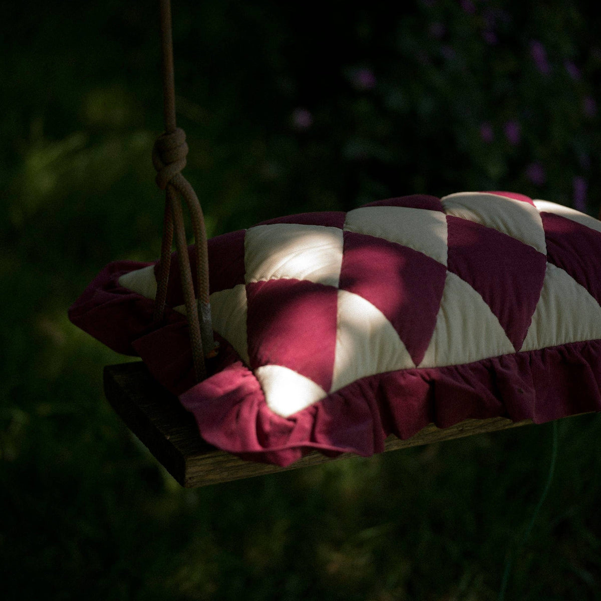 Luxury burgundy and cream patchwork cushion with quilted Harlequin design.