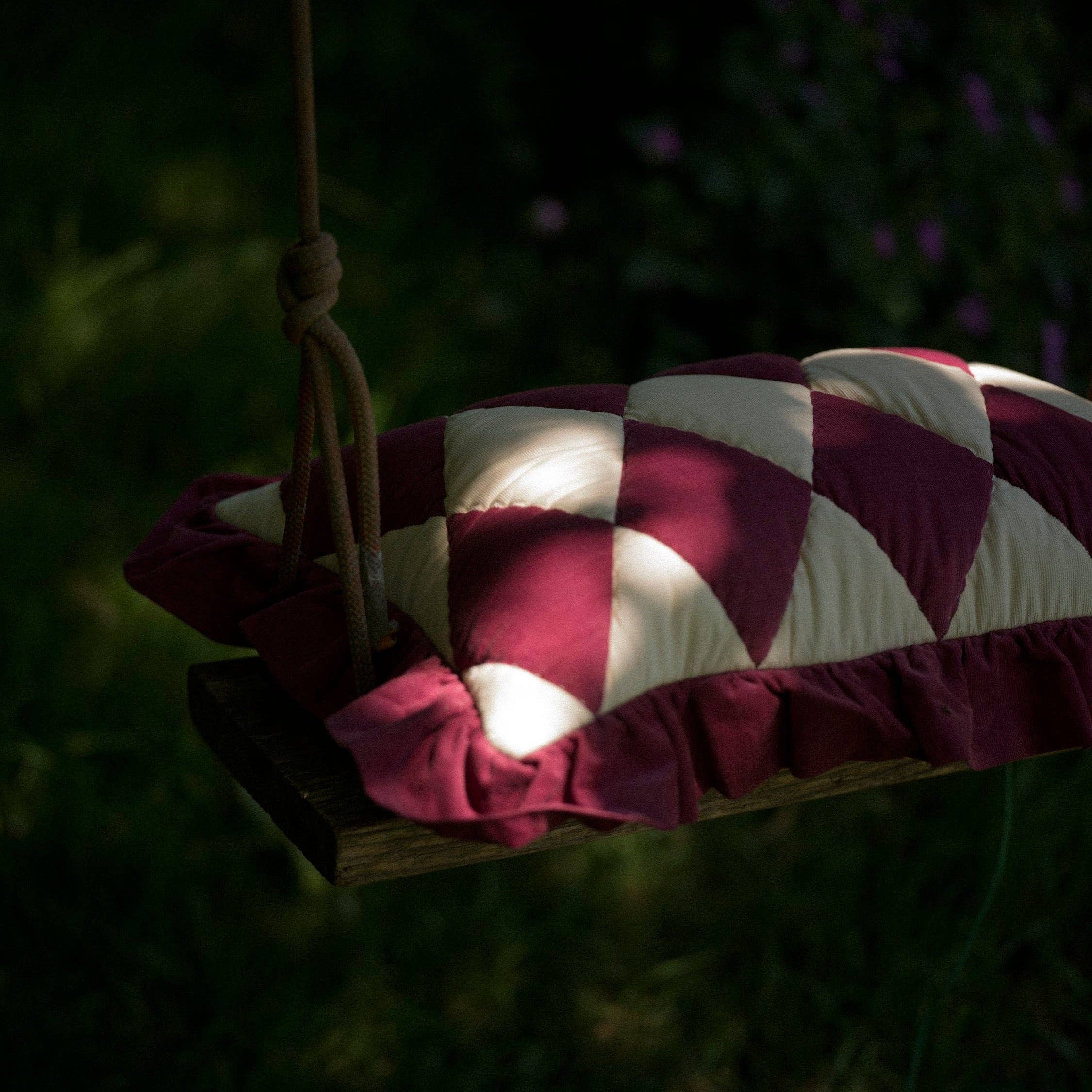 Luxury burgundy and cream patchwork cushion with quilted Harlequin design.