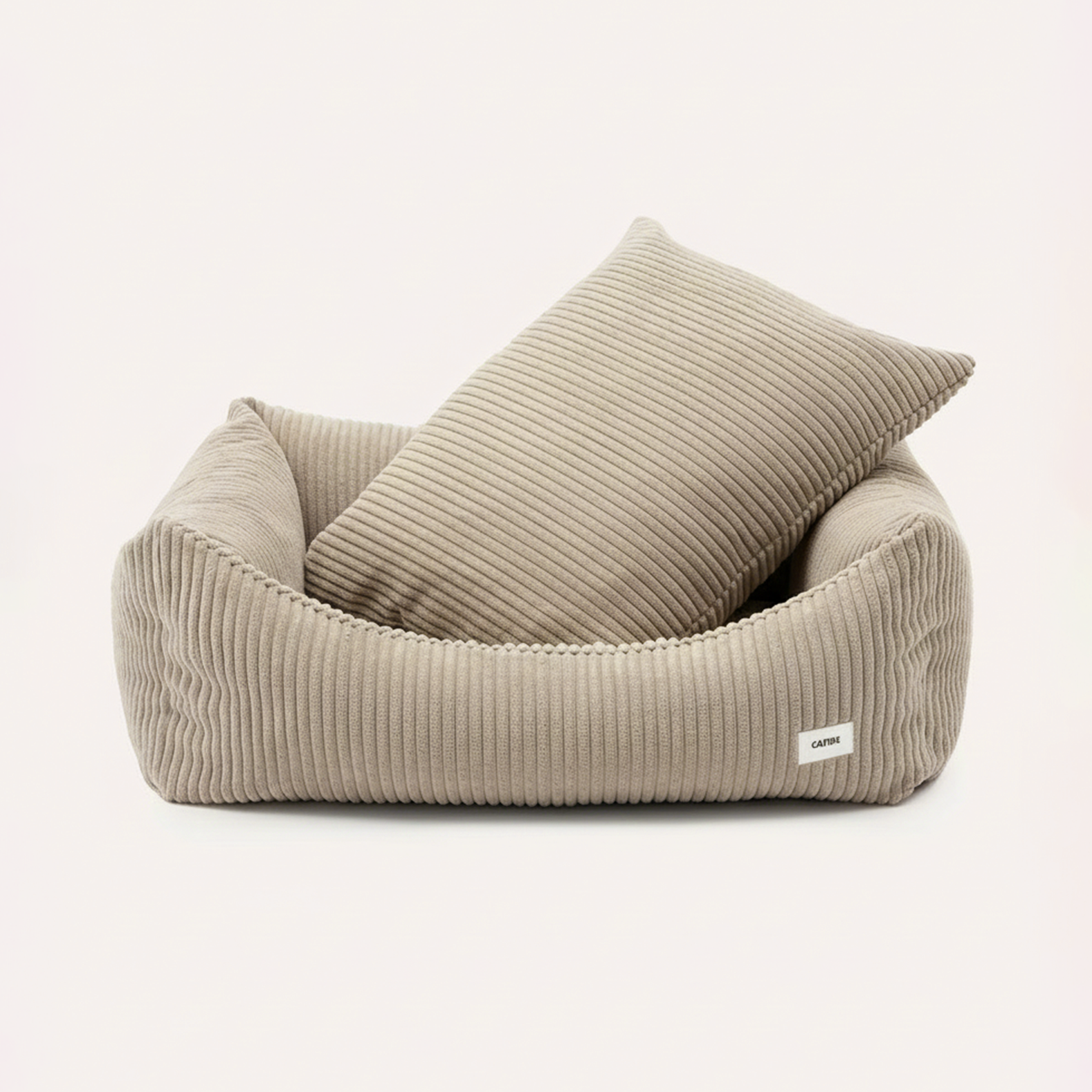 CAFIDE Snozy beige corduroy dog bed with raised sides and recycled foam filling.