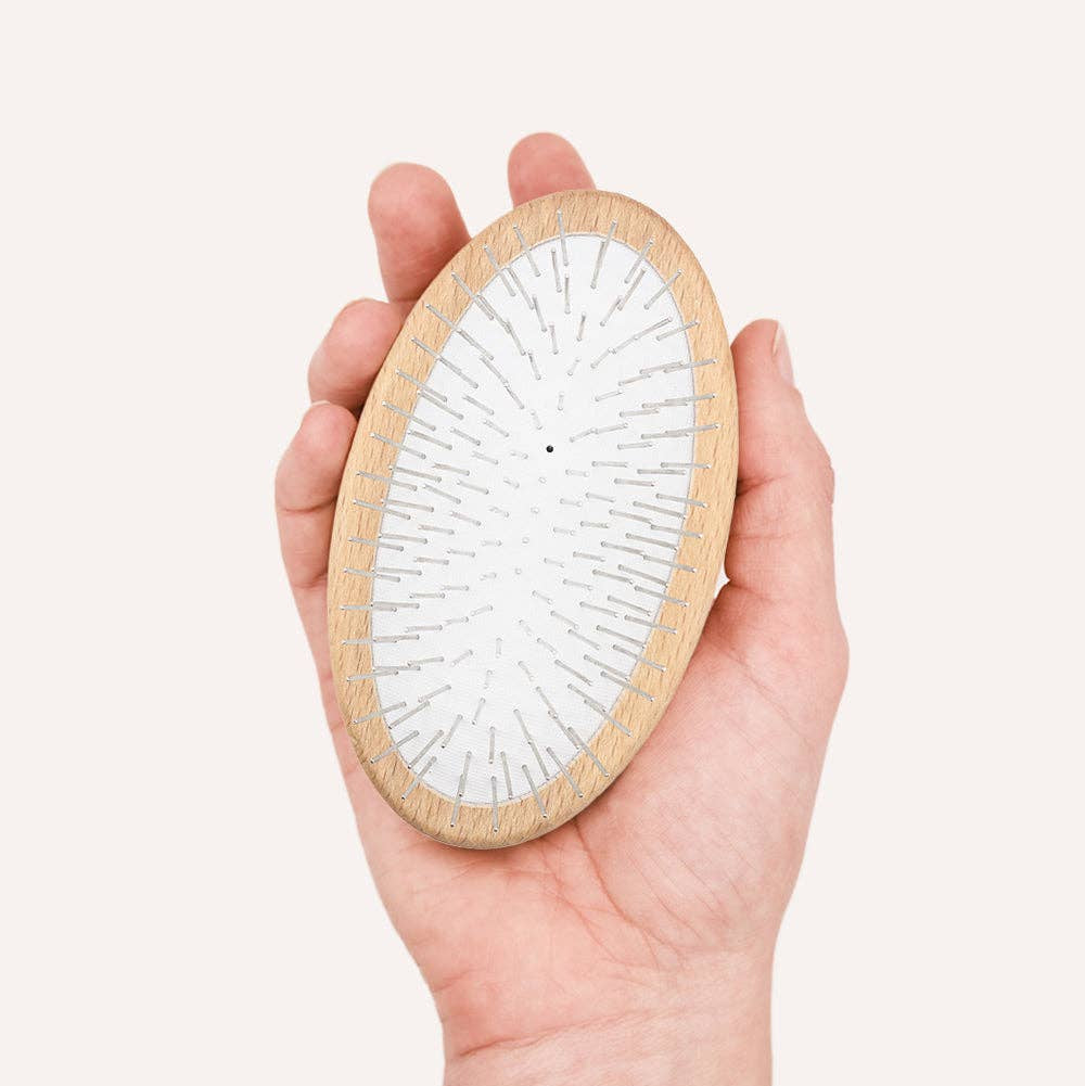 CAFIDE Teo long hair dog brush with FSC-certified beech wood handle and rounded metal pins.