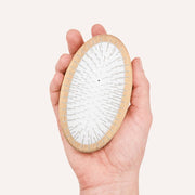 CAFIDE Teo long hair dog brush with FSC-certified beech wood handle and rounded metal pins.