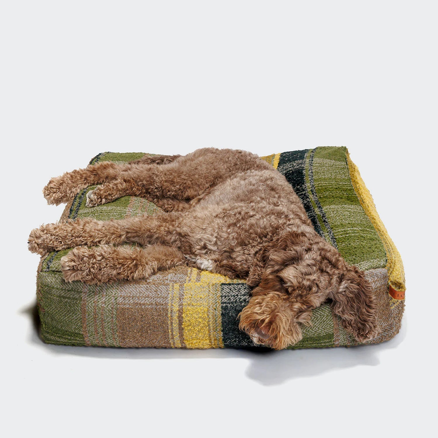 Premium cube-style dog bed with supportive filling and heritage tartan upholstery.