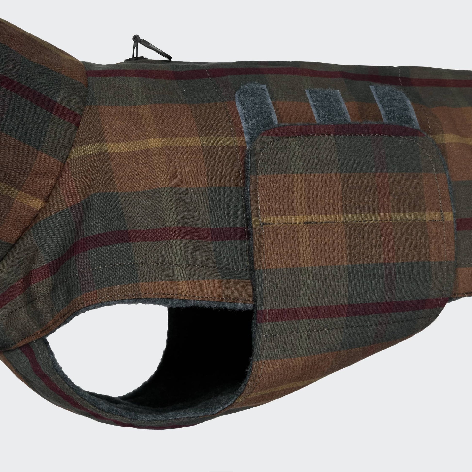 Plaid-patterned dog coat on a white background