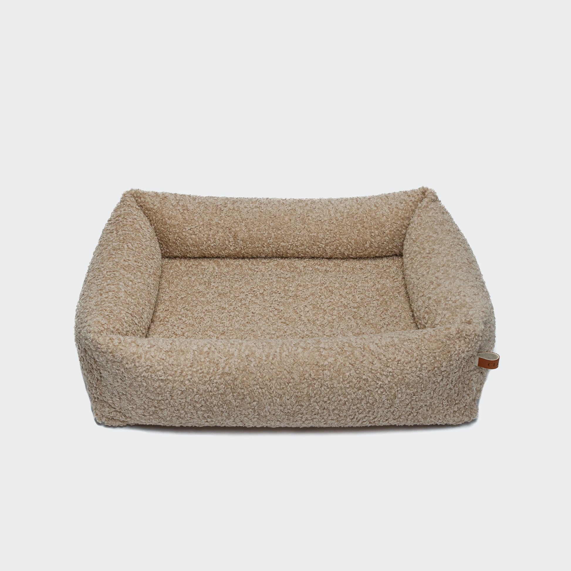 Cloud7 Dog Bed Sleepy Deluxe Curl Cream with ultra-soft bouclé fabric and supportive raised sides from Bell & Beau.
