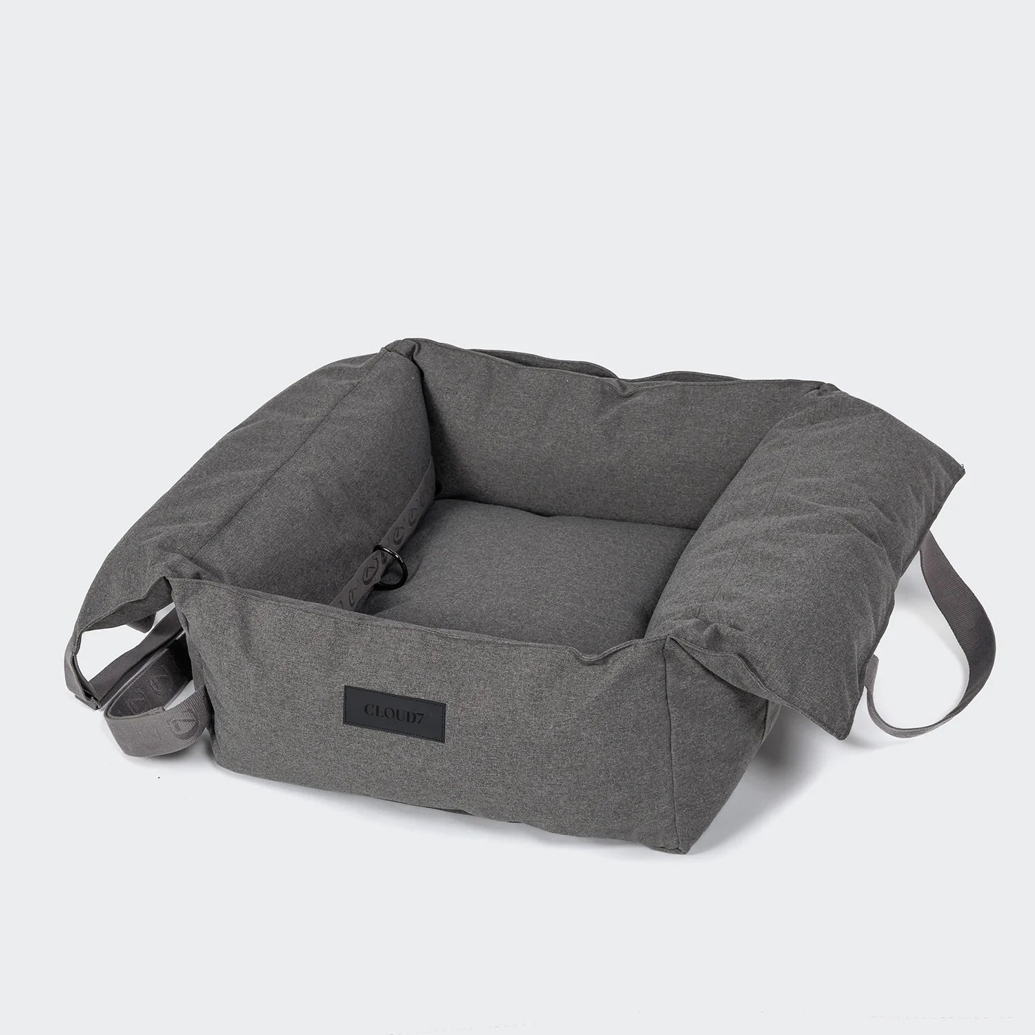 Gray pet bed with a brand label on a white background