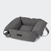 Gray pet bed with a brand label on a white background