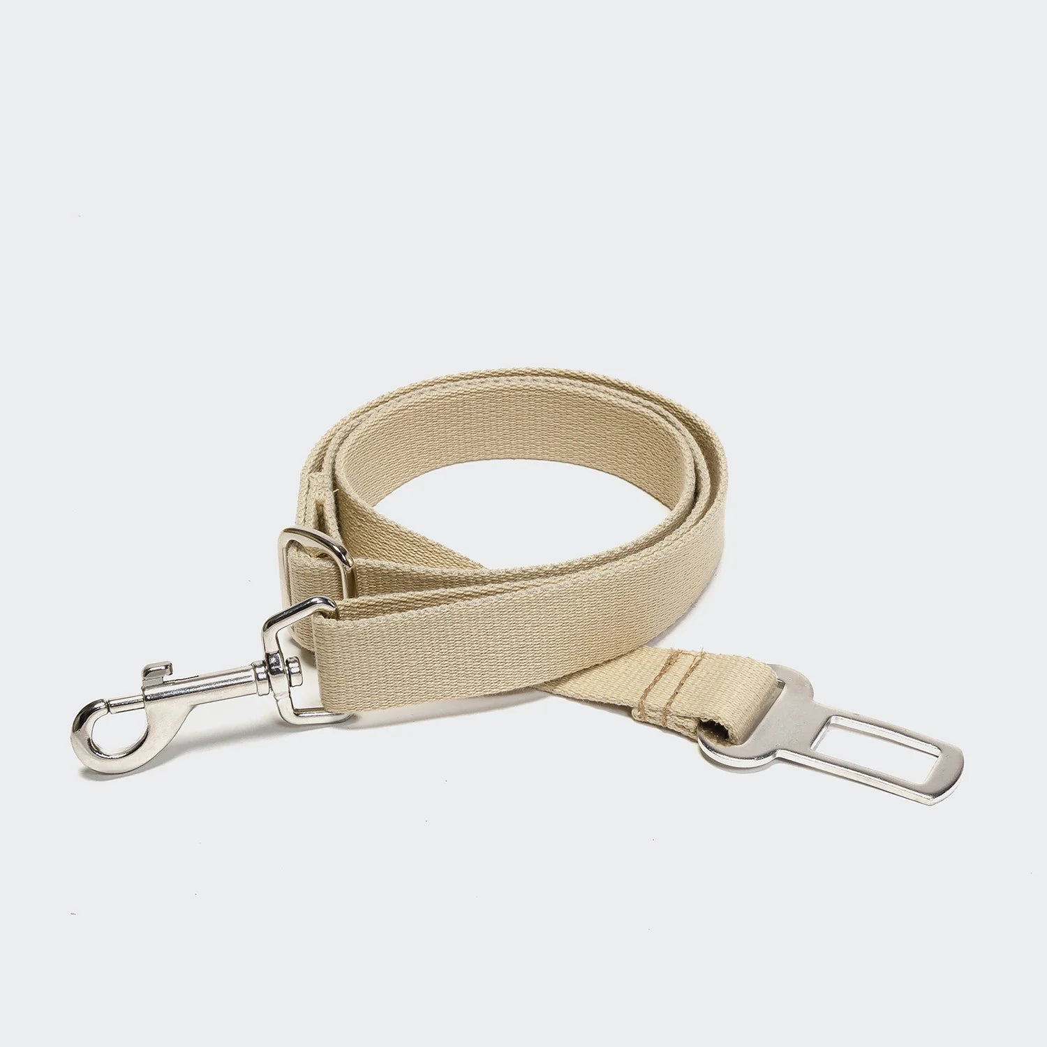 Beige strap with metal hardware on a white background