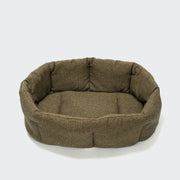Brown pet bed on a white background