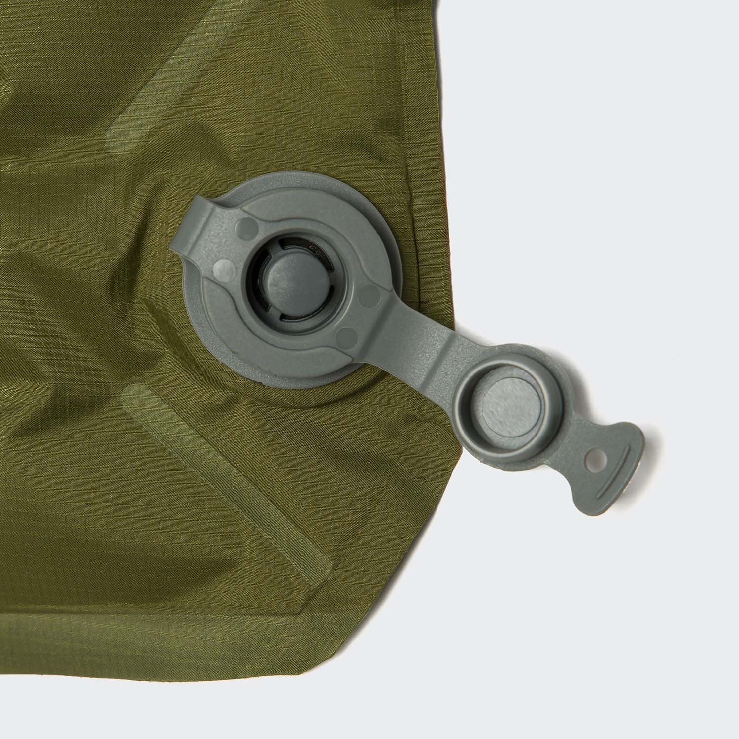 Close-up of a green inflatable bag with a gray valve on a white background