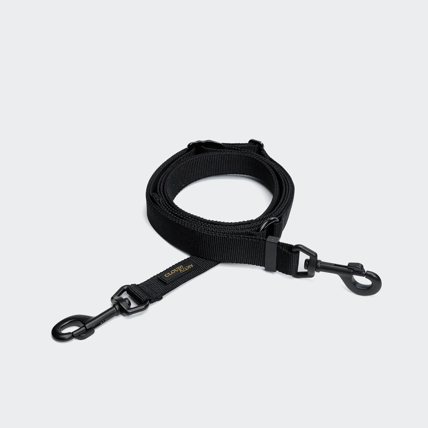 Black dog leash with clip on a light gray background