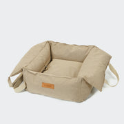 Cloud7 Portable Dog Car Seat Getaway Sand with padded interior and integrated safety attachment from Bell & Beau.