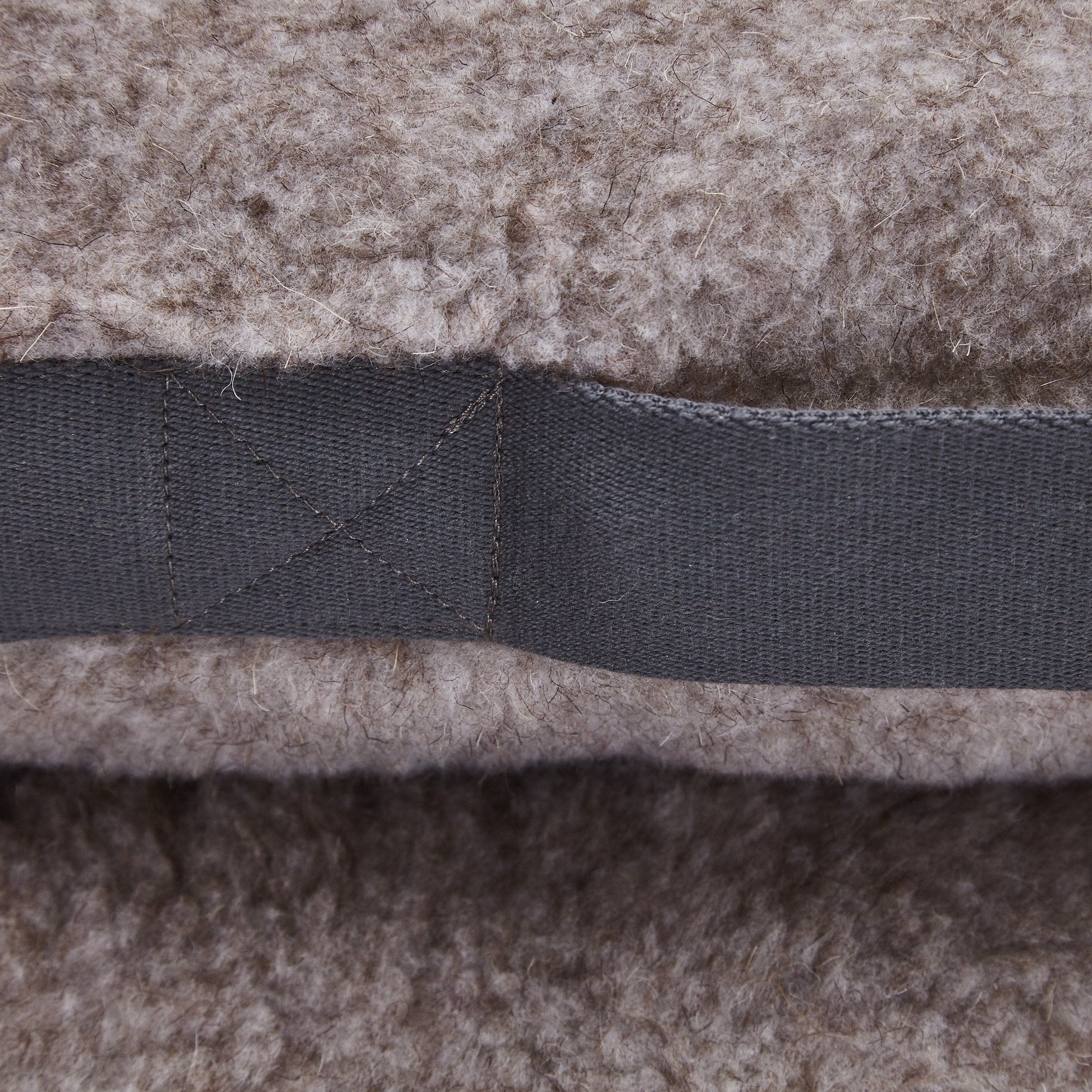 Soft teddy fleece dog bed with supportive cushioning and removable inner cushion.