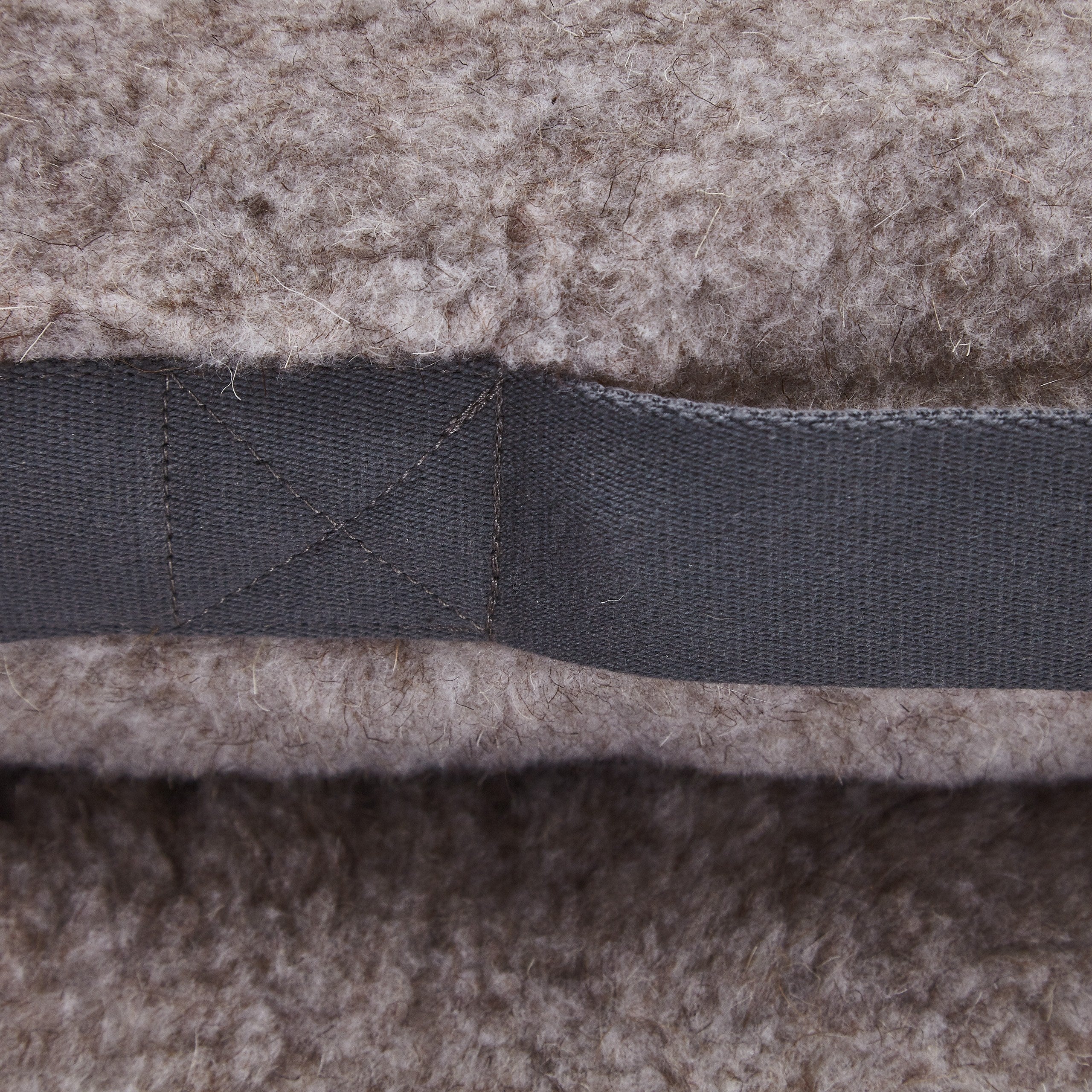 Soft teddy fleece dog bed with supportive cushioning and removable inner cushion.