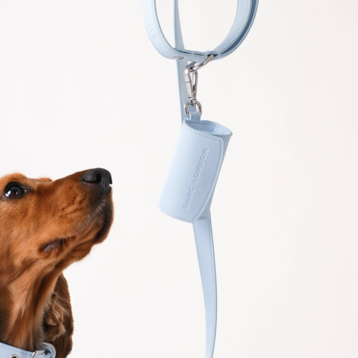 Blue vegan leather dog poo bag holder by Barc London.