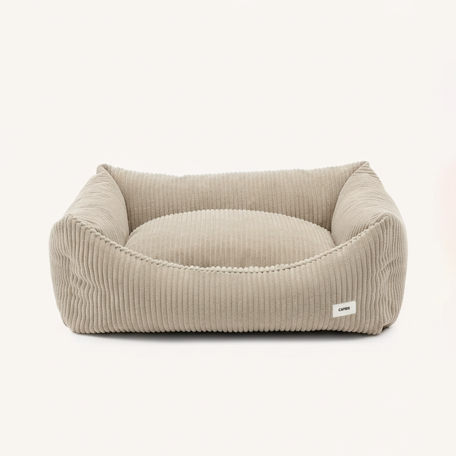 Stylish beige dog bed crafted from durable upholstery-grade corduroy.
