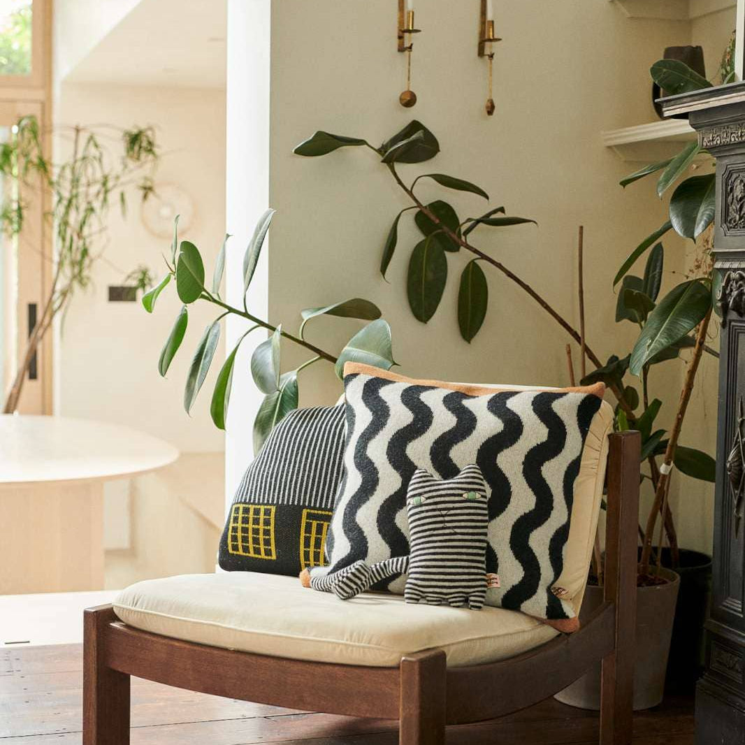 Modern Donna Wilson cushion adding colour and texture to stylish interiors.