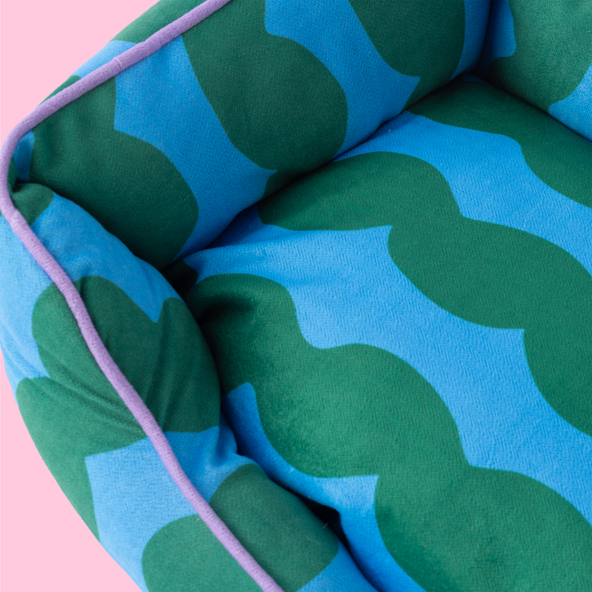 Soft basket-style dog bed with anti-slip base and supportive raised sides.