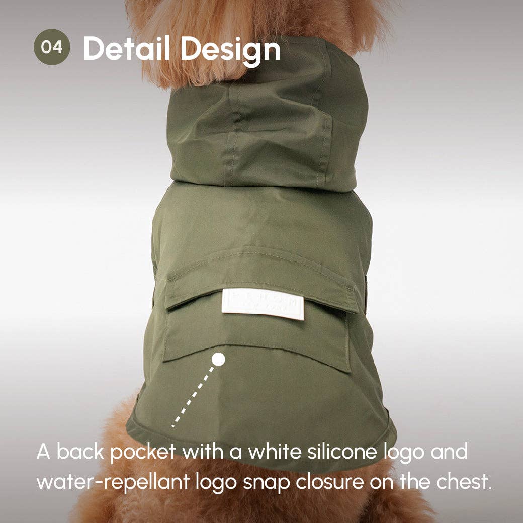 Green dog coat with a back pocket and water-repellent logo snap closure on a white background.