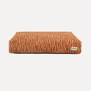 DOGGUO Ethnic beige and brown orthopaedic dog bed in patterned jacquard fabric