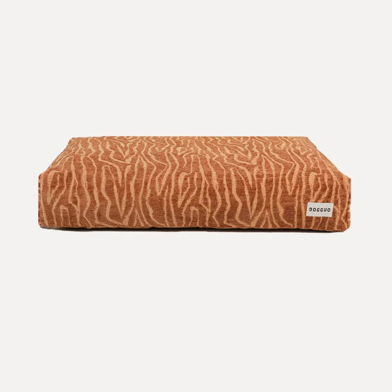 DOGGUO Ethnic beige and brown orthopaedic dog bed in patterned jacquard fabric