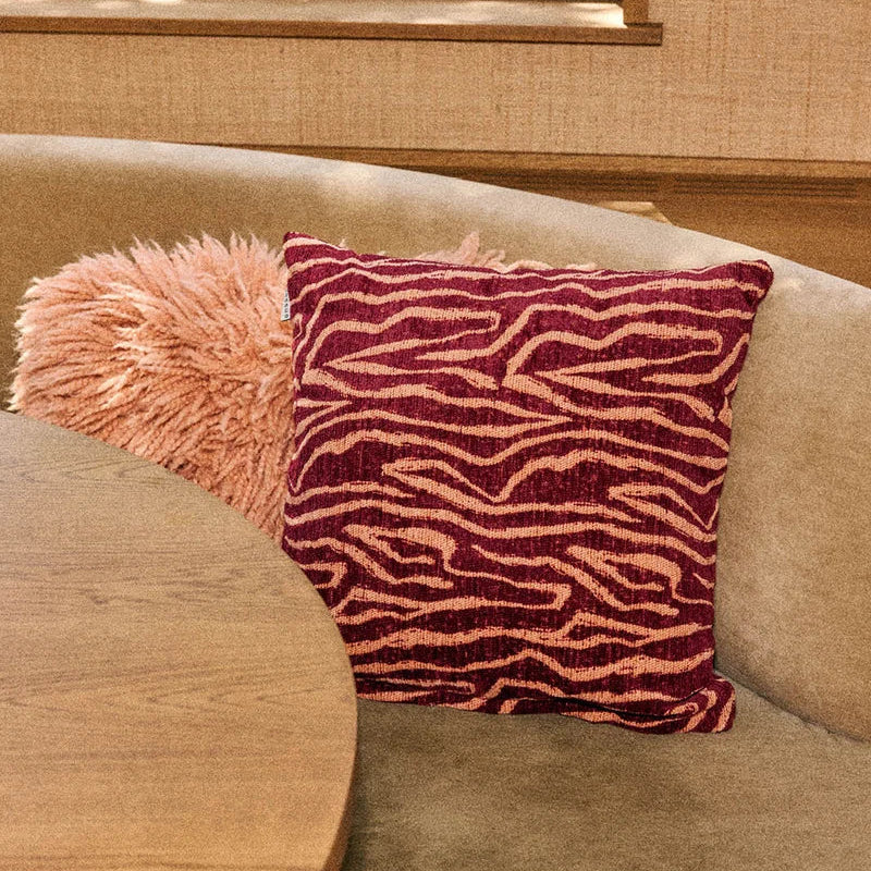 Peach and bordeaux DOGGUO Ethnic interior cushion with graphic jacquard pattern