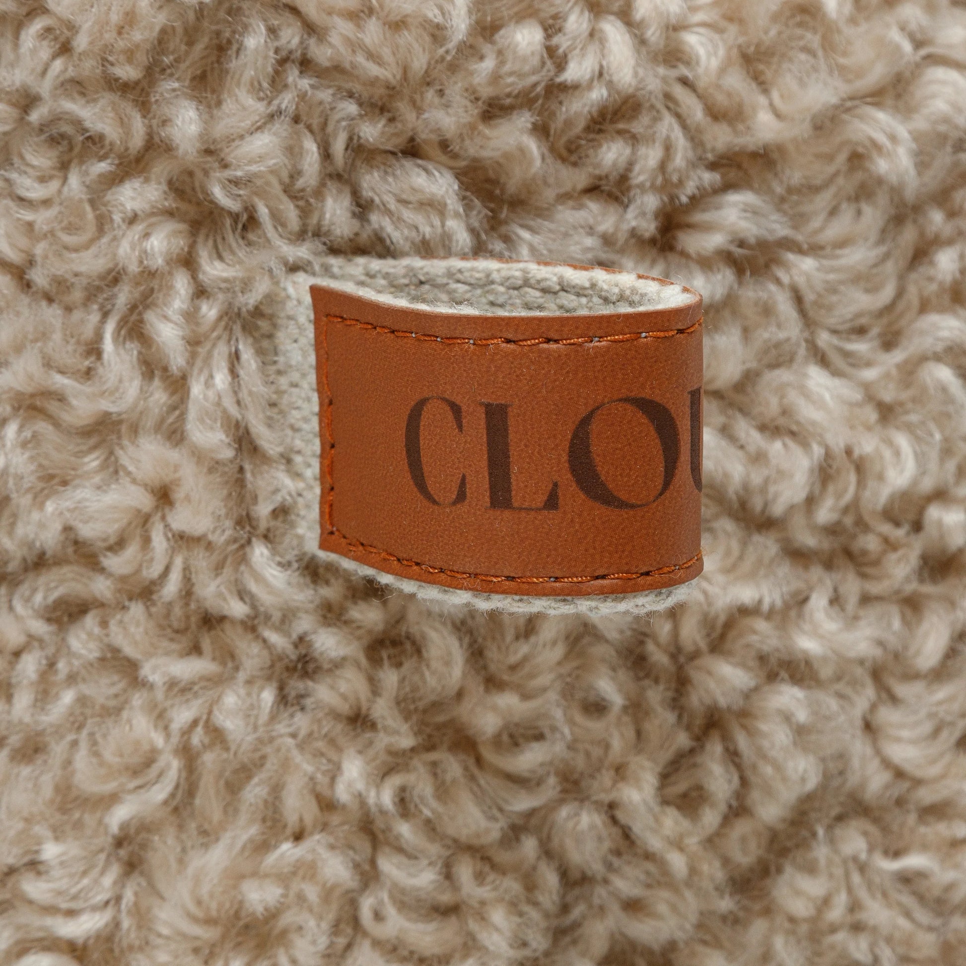 Cloud7 Sleepy Deluxe Curl Cream dog bed designed for dogs who love to curl up and relax.