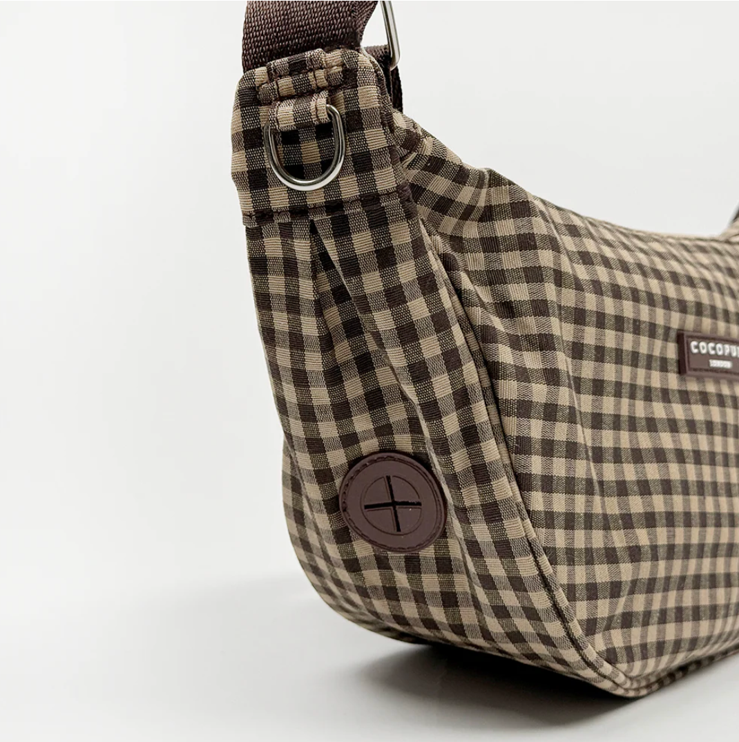 Cocopup designer dog walking bag with built-in poo bag dispenser and organised storage.