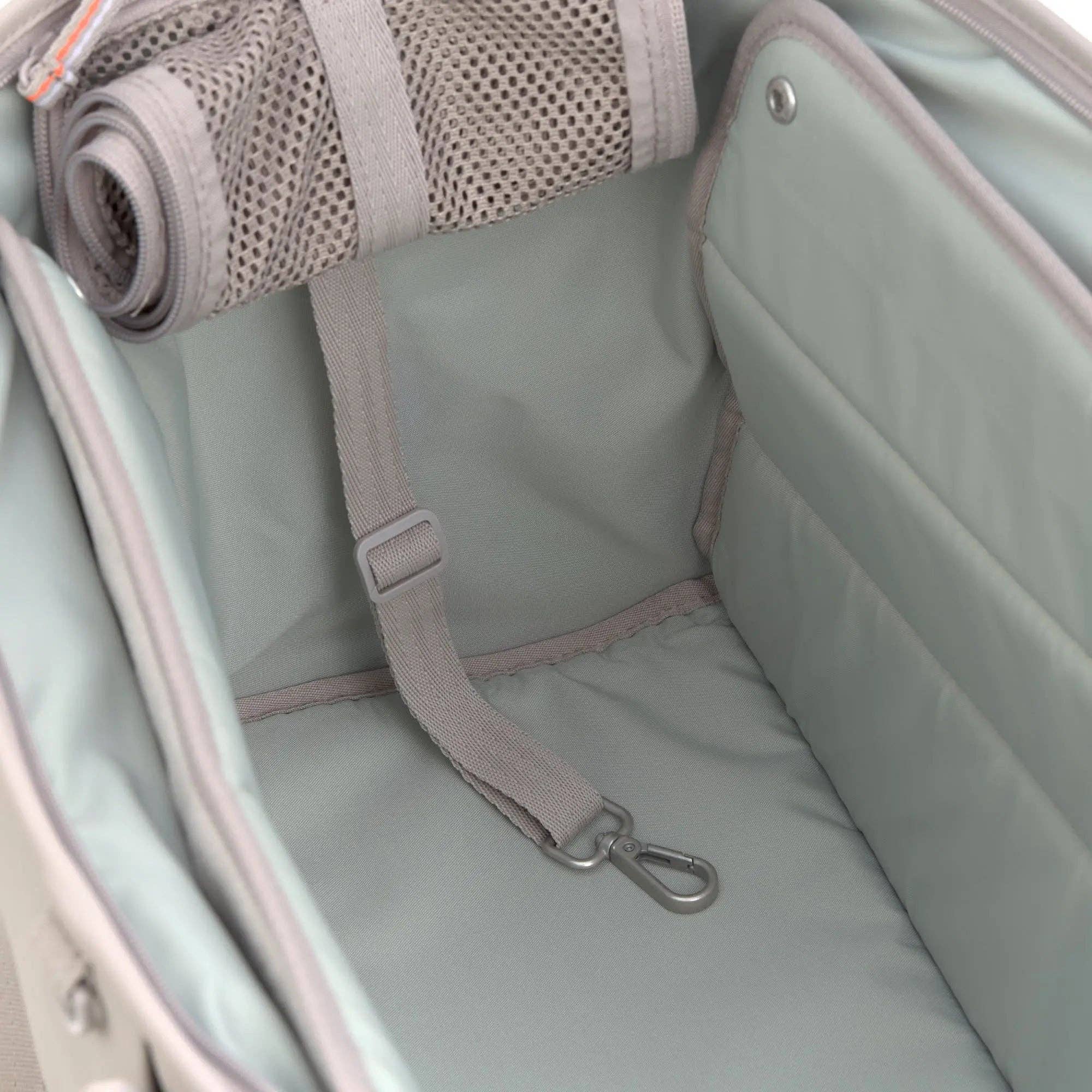 Reversible comfort mat with cooling and warming sides inside the PALOPA Weda dog carrier.
