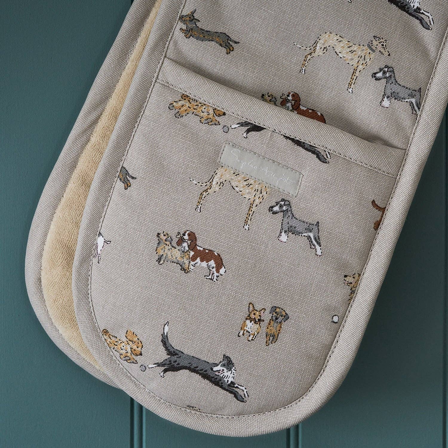 Cotton double oven glove with charming Doggy Daycare dog illustrations.