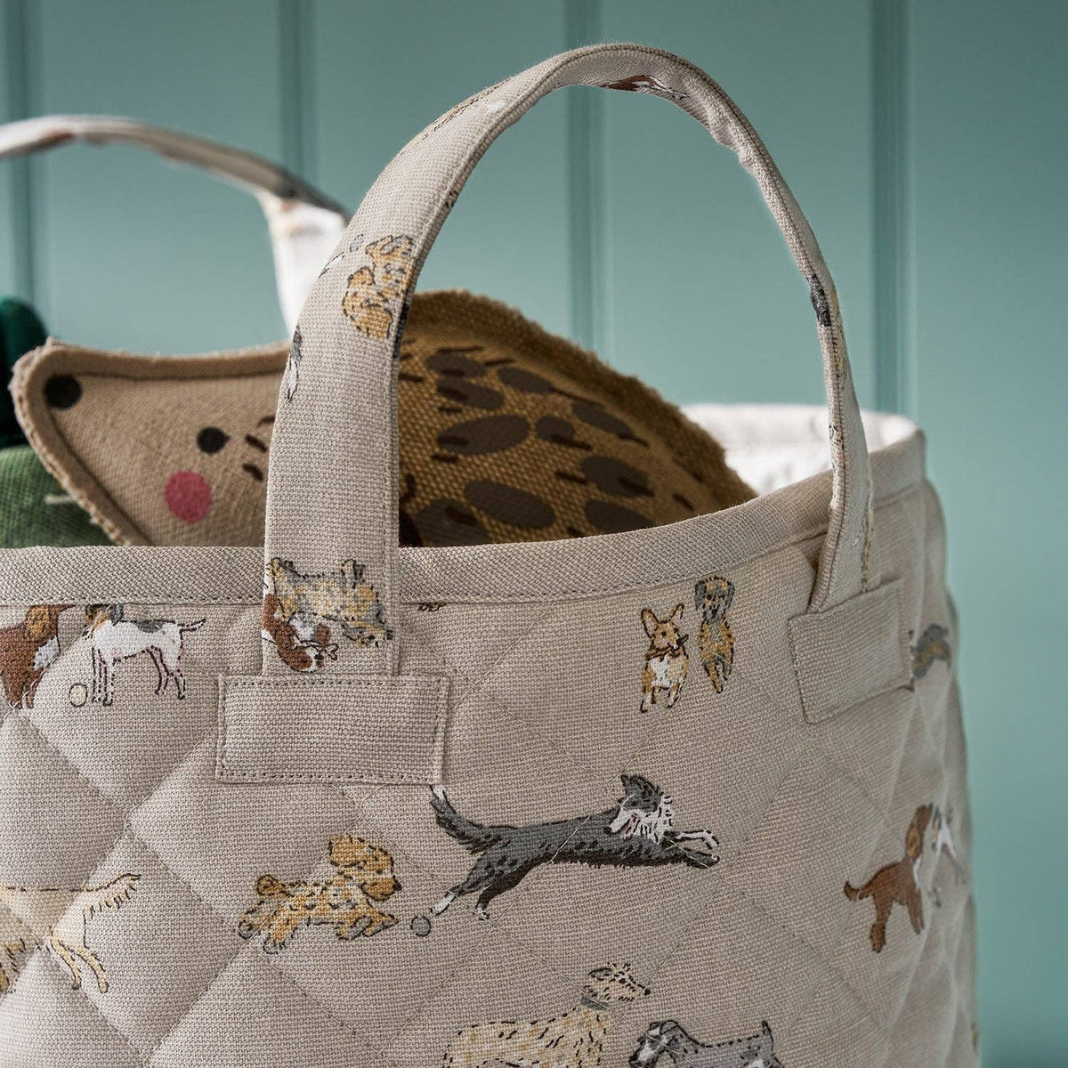 Quilted cotton storage basket featuring playful Doggy Daycare dog illustrations.