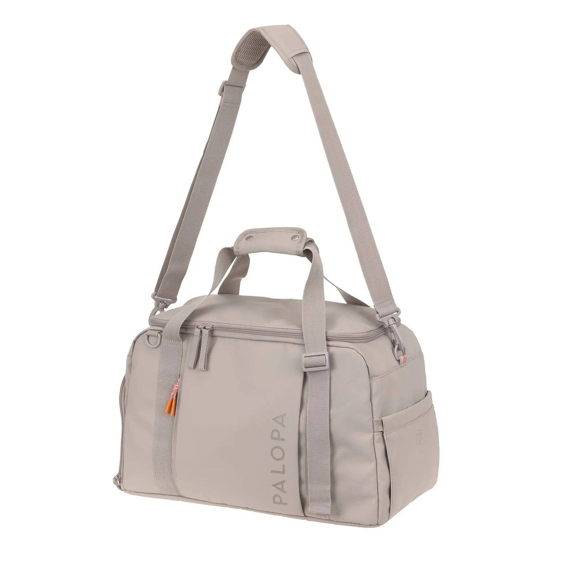 Beige duffel bag with shoulder strap on a white background