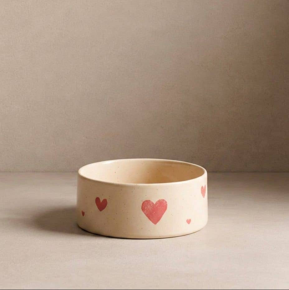 Dog eating from the Egg Back Home Cozy Hearts Stoneware Pet Bowl Set of 2