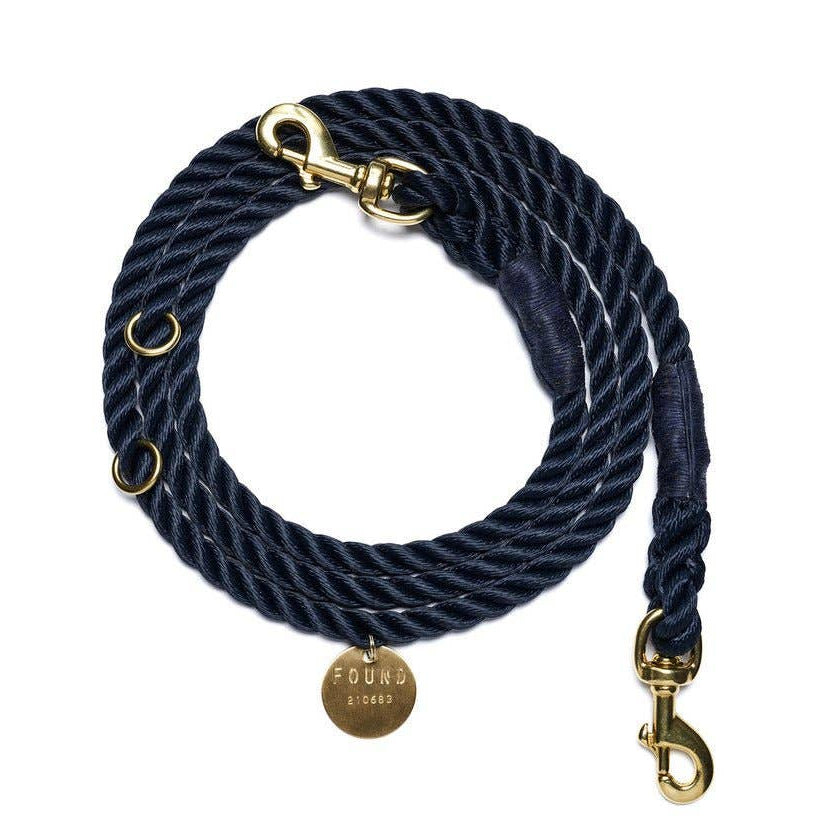 Navy blue rope dog leash with gold hardware on a white background