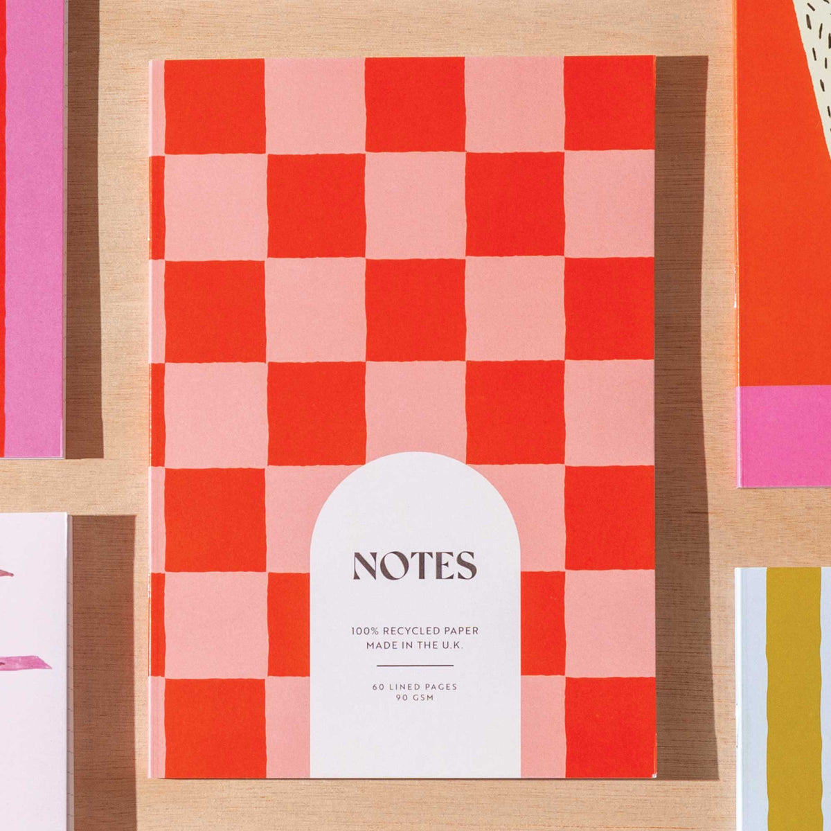 Good Tuesday Peach and Cherry A5 lined checkerboard notebook.