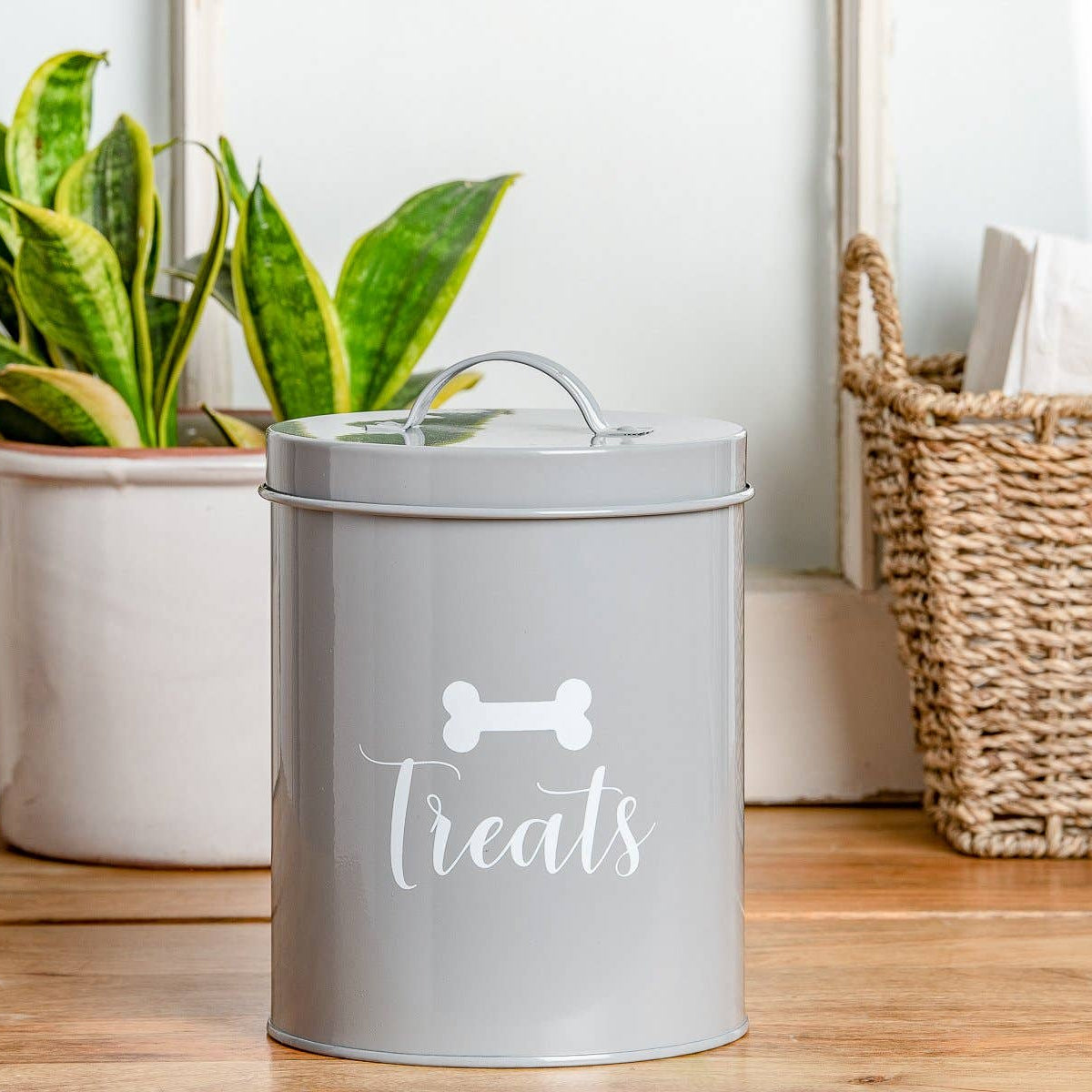 Stylish grey ceramic airtight storage jar for dog treats and biscuits.