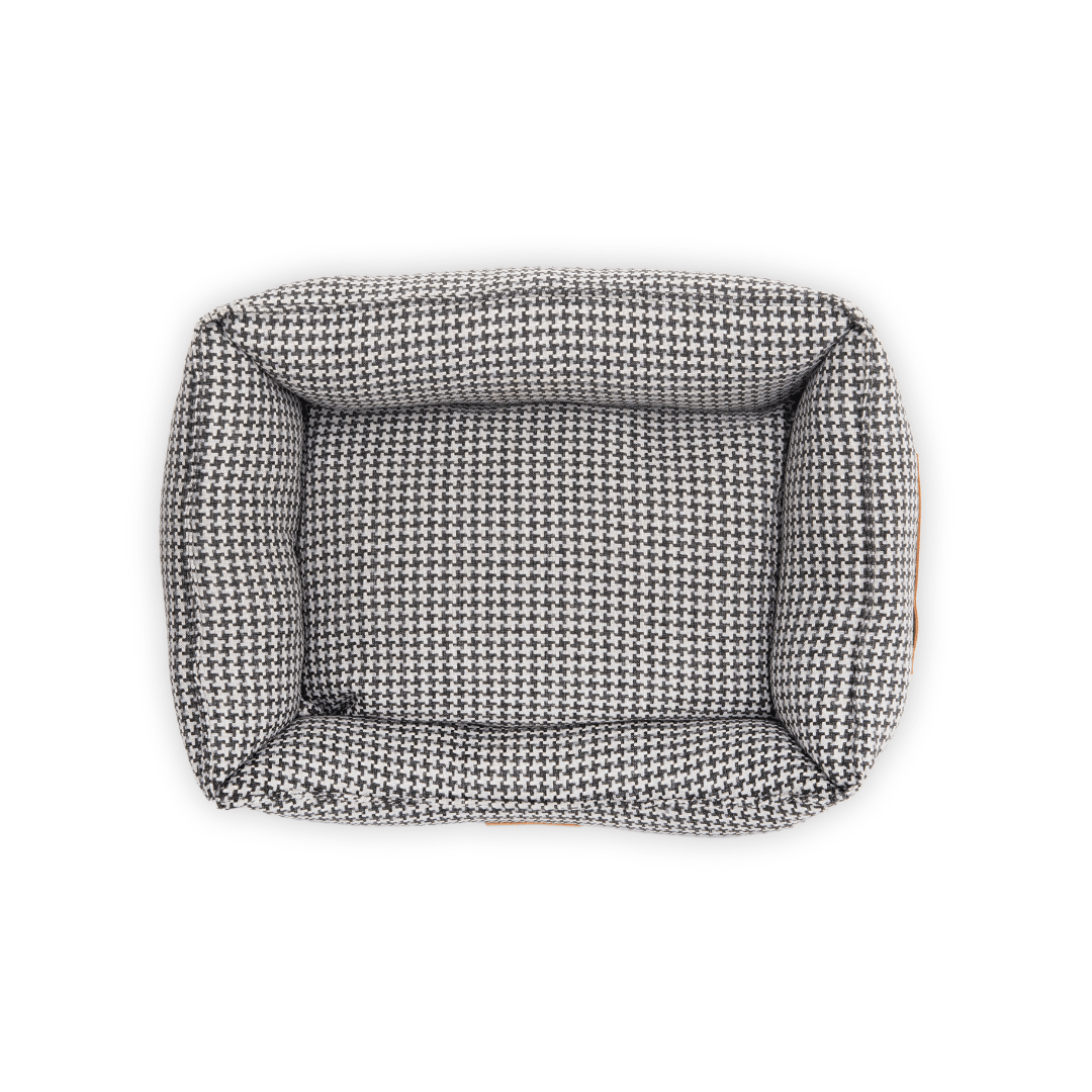 Close-up of the black and white houndstooth upholstery fabric on the Kensington dog bed