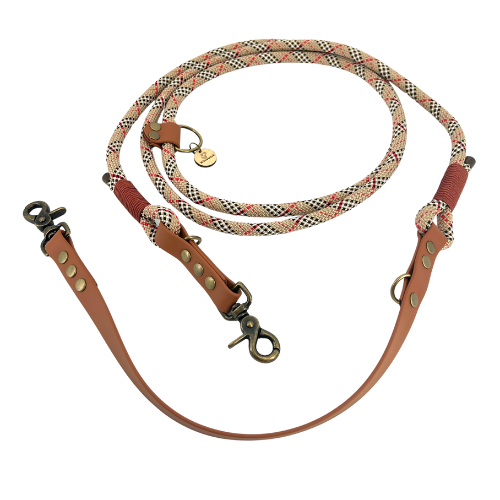 Handmade Kitsunē multi-position dog lead crafted from brown BioThane® and tartan paracord.