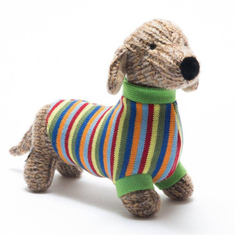 Knitted dog toy with a colorful striped sweater on a white background