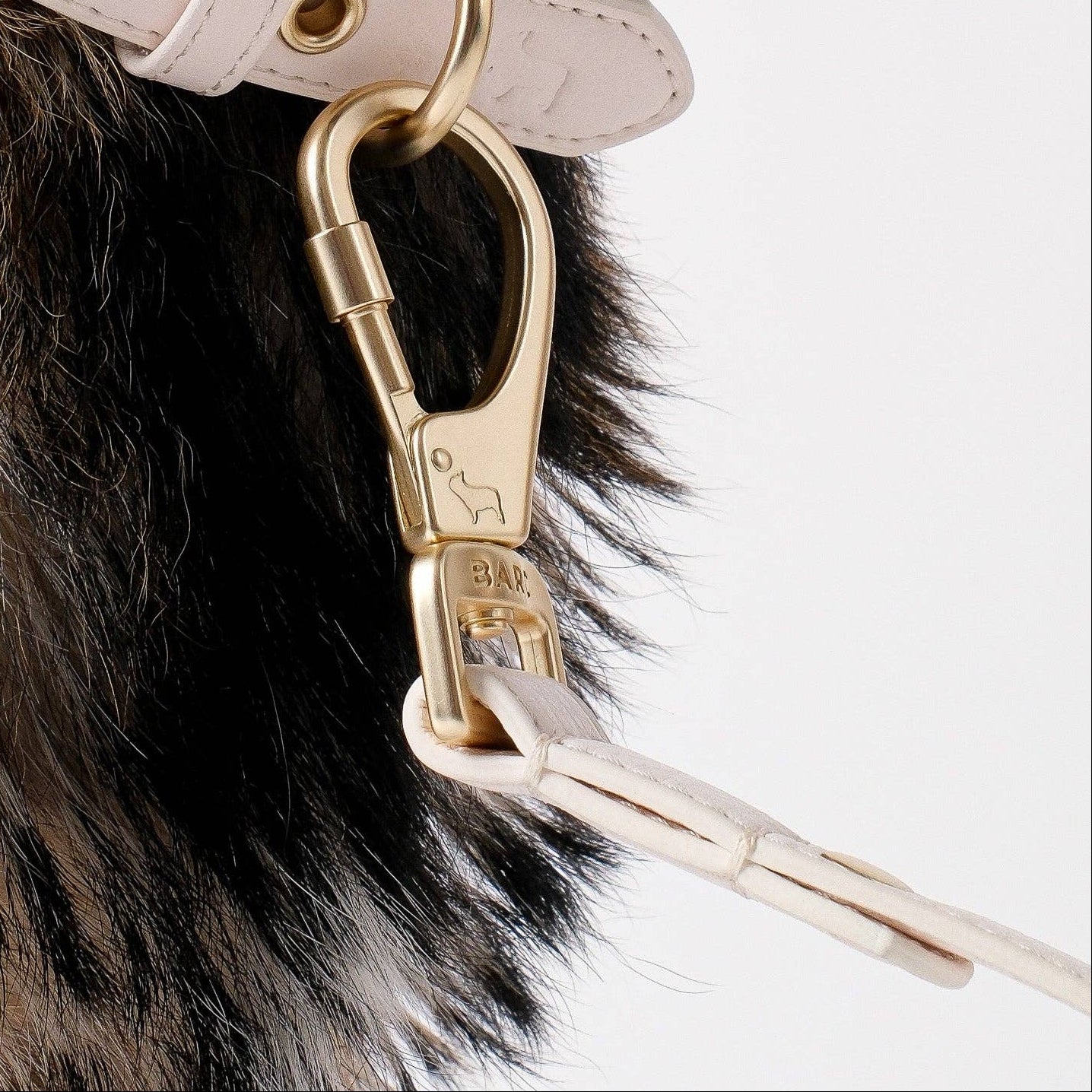 Soft cream vegan leather dog lead with gold clasps by Barc London.