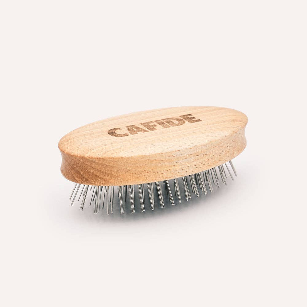 Premium grooming brush designed to detangle and maintain long-haired dog coats.