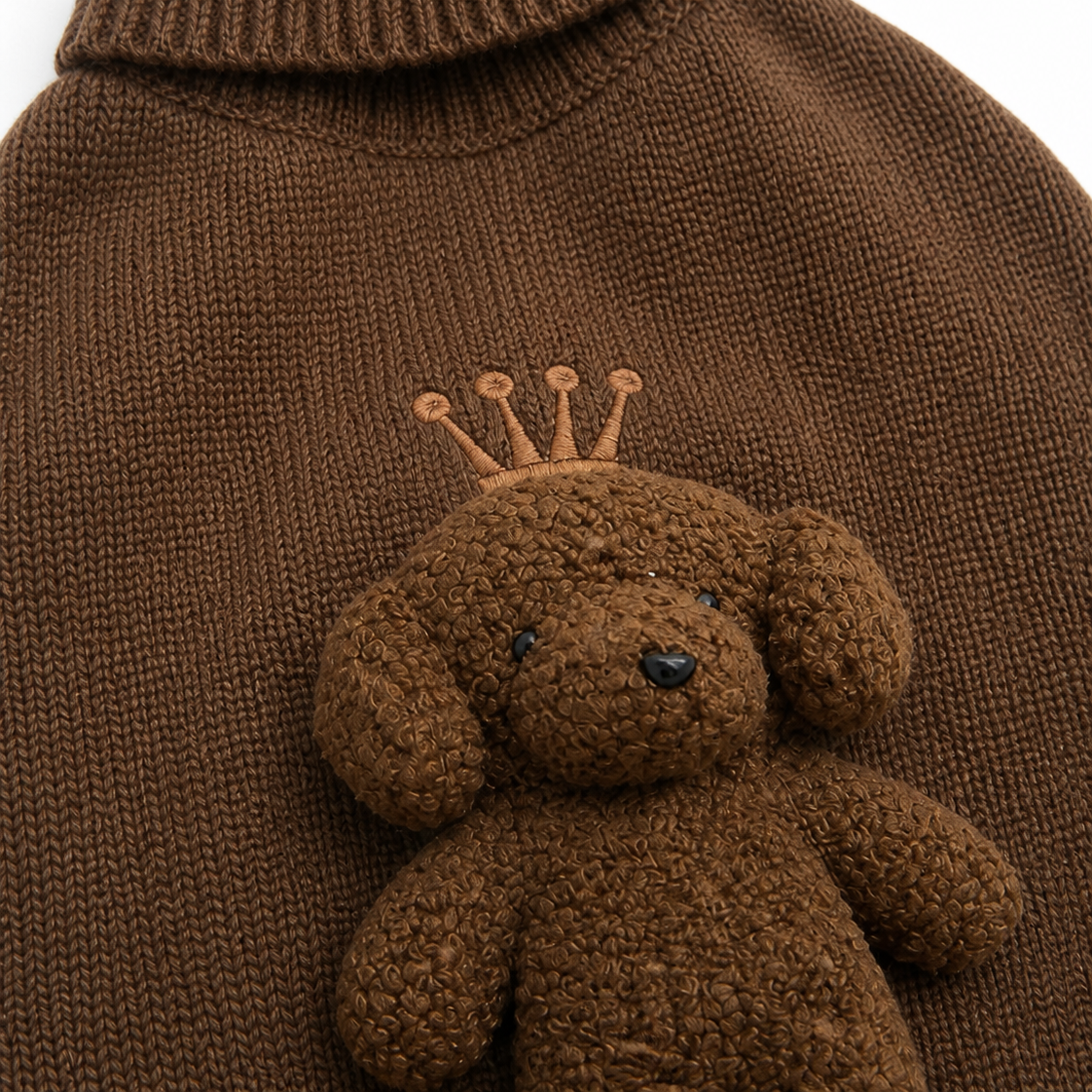 Playful designer knitted dog jumper with three-dimensional bear detail.