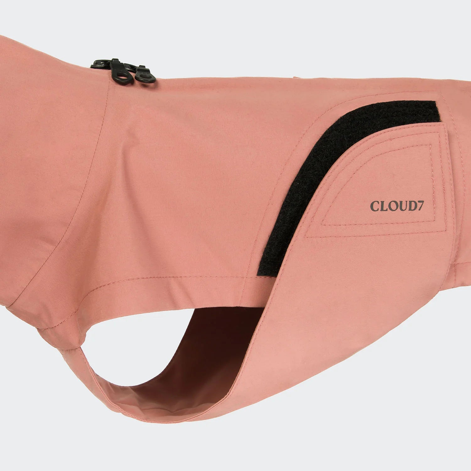 Pink dog coat with black trim and 'CLOUD7' branding on a light gray background